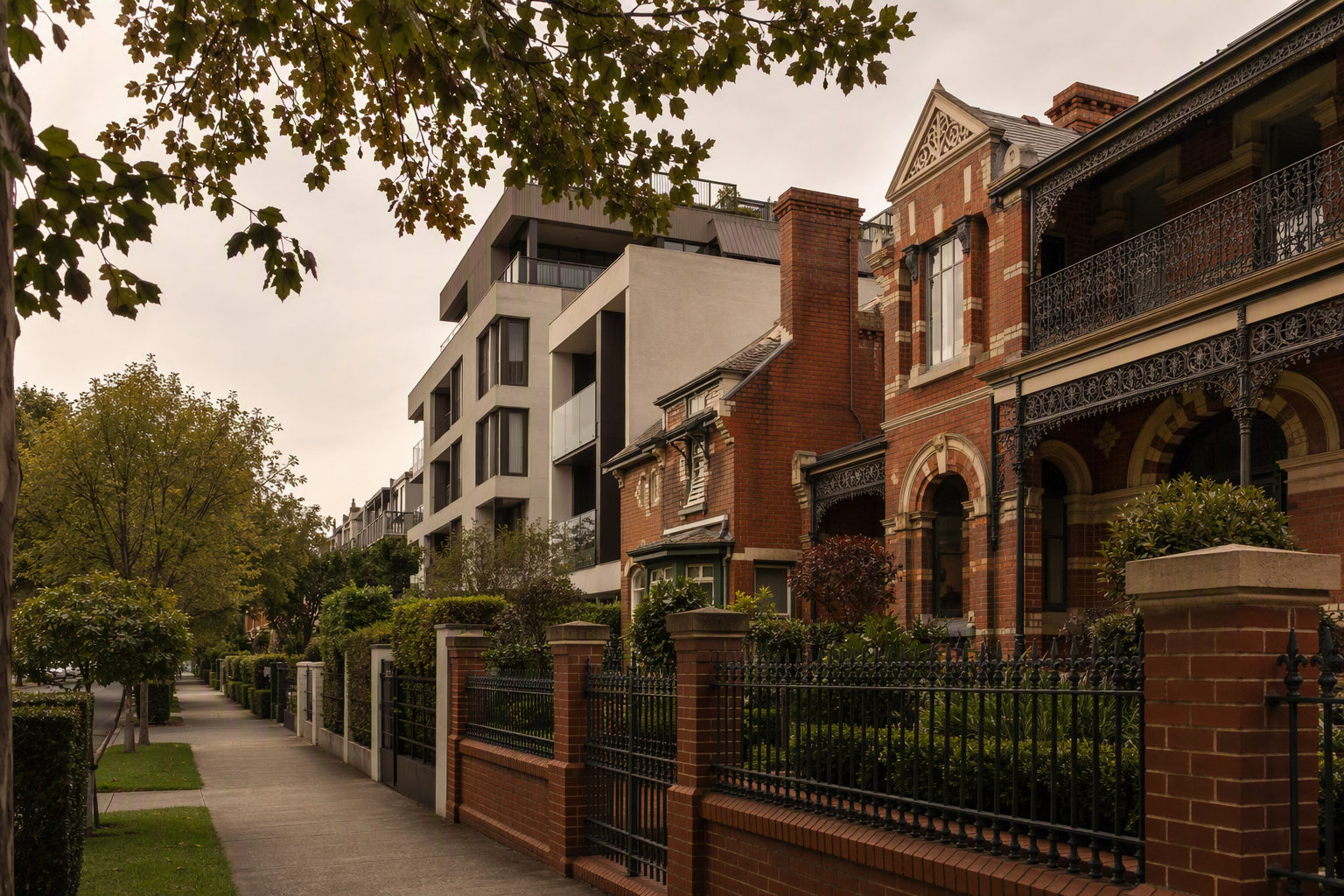 Leafy Hawthorn street mixing red brick period homes with a contemporary apartment building