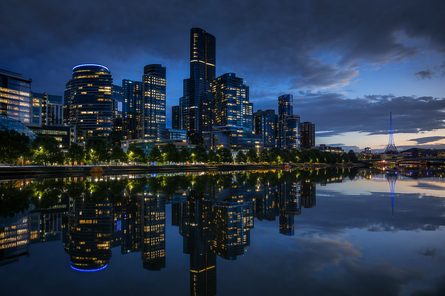 Southbank Melbourne skyline of glass residential towers reflected in the Yarra River at dusk