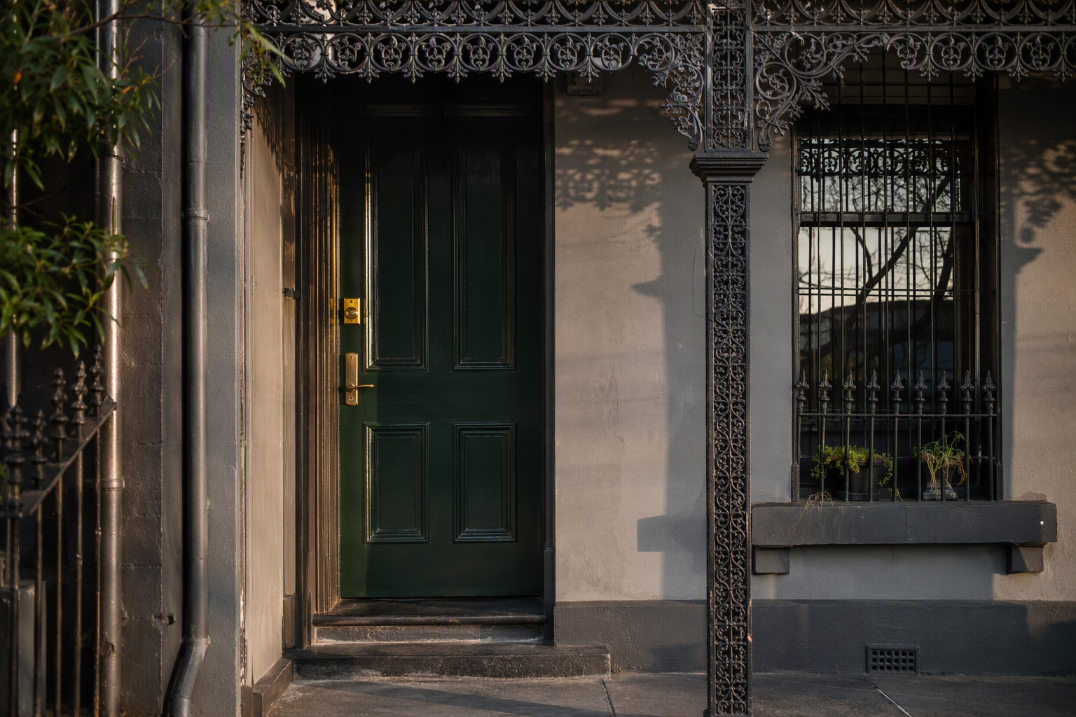 Victorian terrace front door with iron lacework verandah