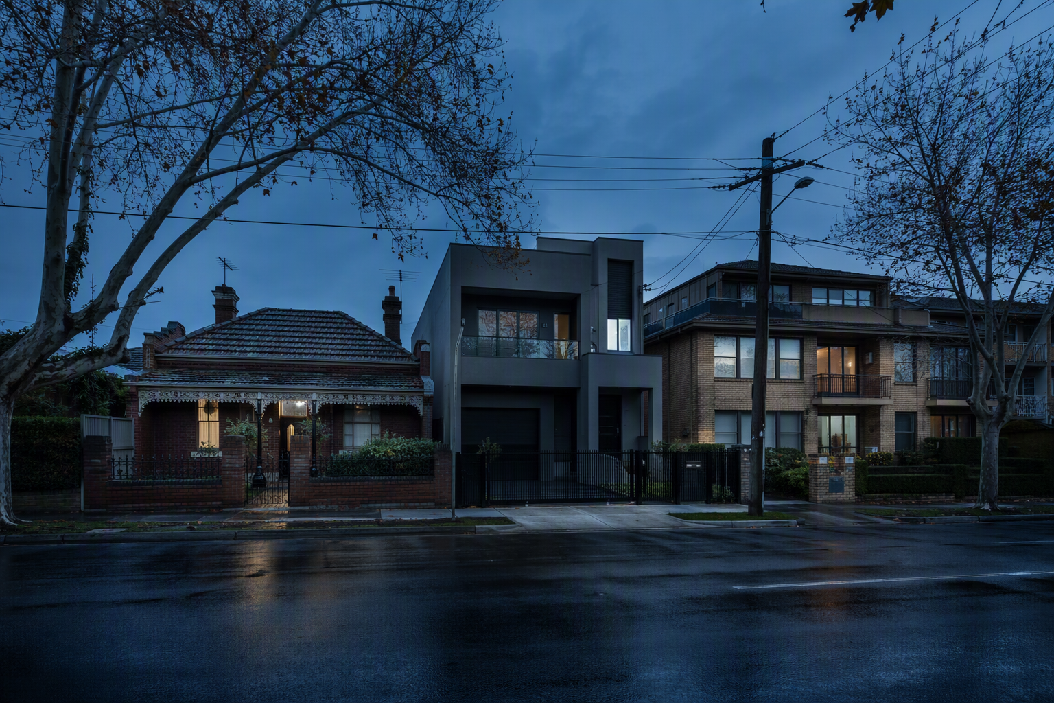 South-eastern Melbourne street with brick houses, a rendered townhouse and a low apartment block