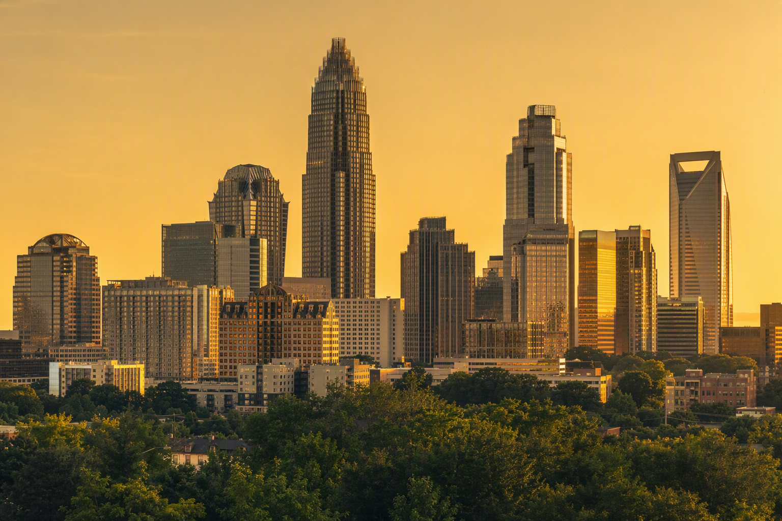 Wide view of the Uptown Charlotte skyline at golden hour