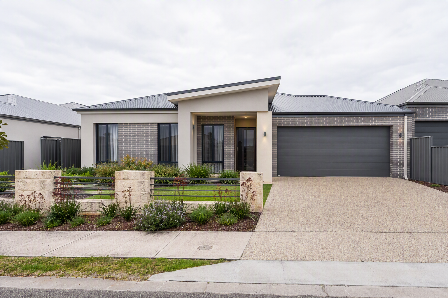 A street of newer brick and render homes in a residential area of Kwinana
