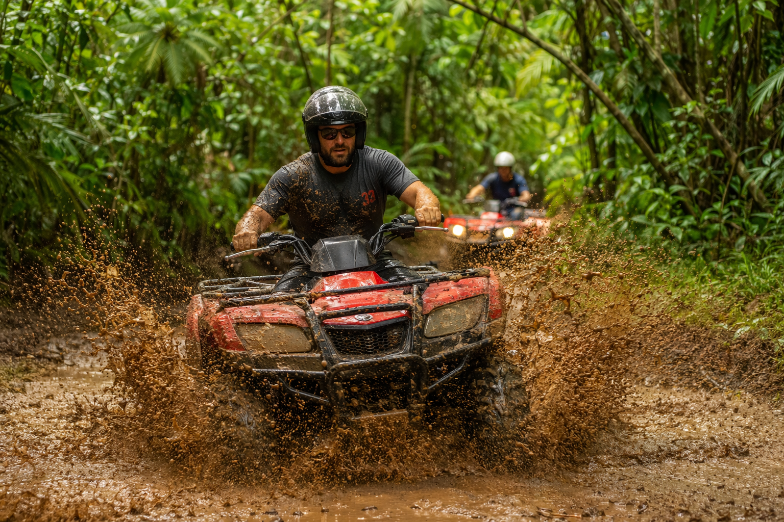 ATV riders on a jungle trail near Jacó