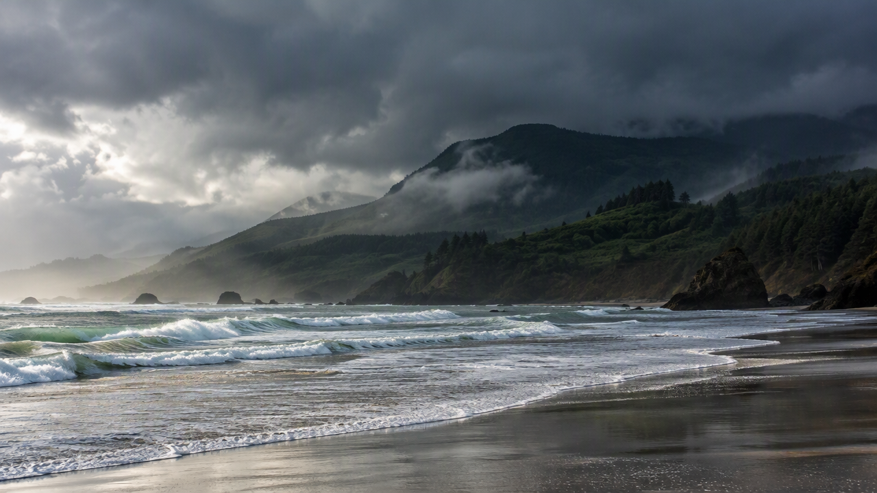 Surfer on a morning wave with afternoon rain clouds